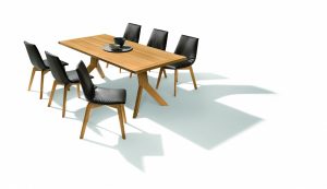 Sitzgruppe mit schwarzen Lederstühlen auf Holzbeinen und einem langen Holztisch